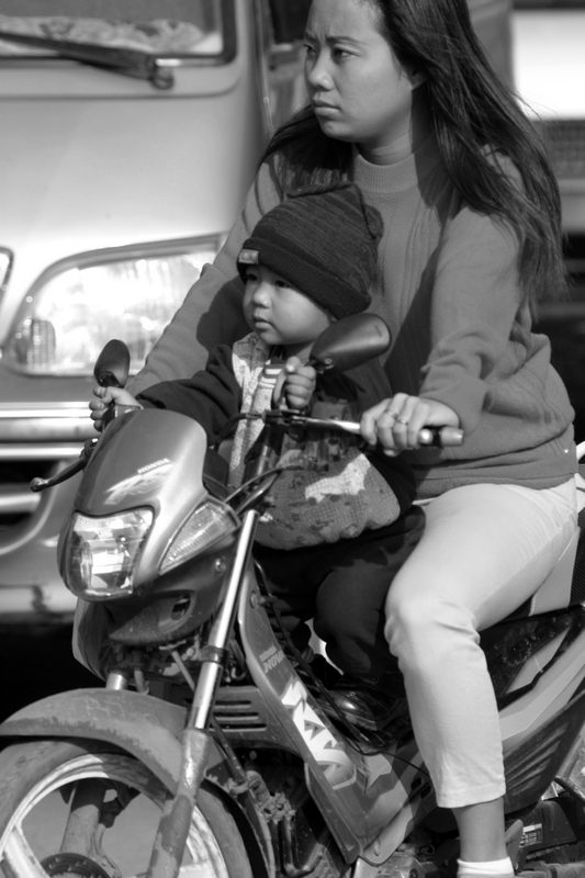 Women and child on motorbike in Phnom Penh